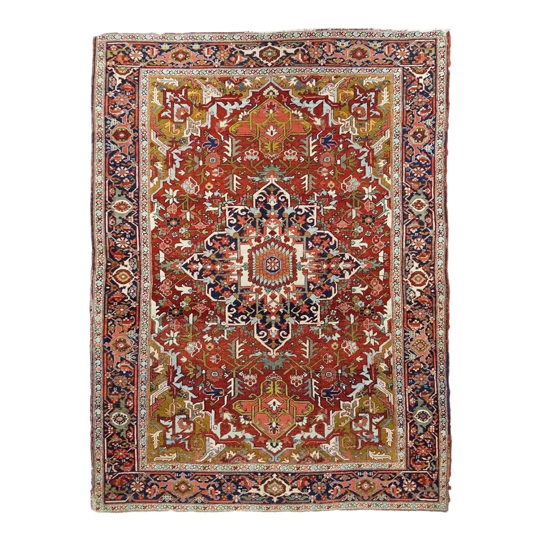 Antique Red Heriz Serapi Rug 4'10'' x 6'9'': An entire room size carpet has been packed into this NW Persian scatter with an all natural dye palette. The navy and ivory octogramme medallion features an ecru sub-medallion, and is centrally placed