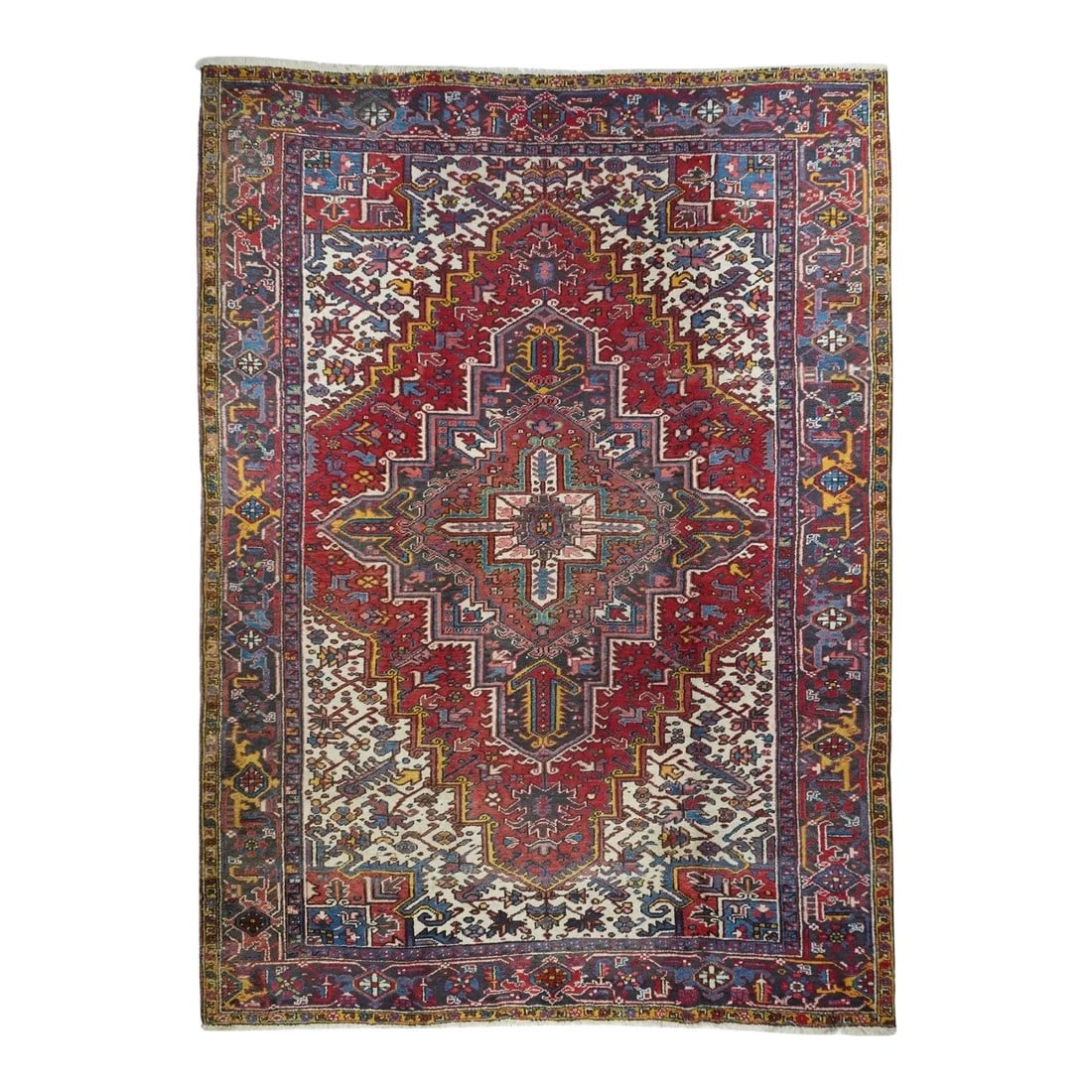 Vintage Heriz Rug 7'10'' x 10'11'': The stepped red field is very slightly concave, centred by a layered blue, rose and cream medallion with internal pendants and radiating flowers. Radiating flowers decorate the field and broad cream s