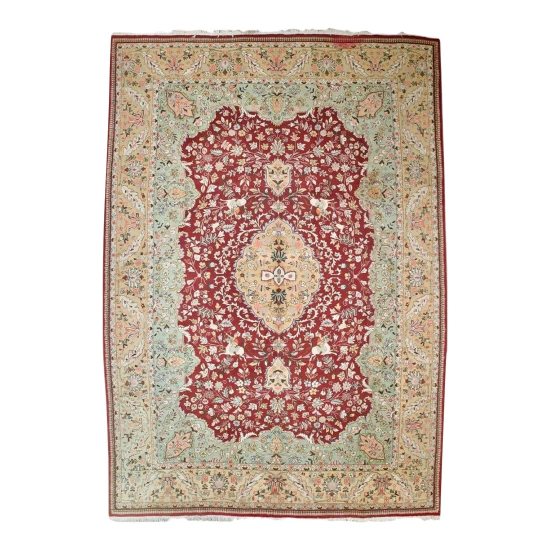 Vintage Persian Tabriz Rug 9'9" X 13'10": Northwestern Persia This urban carpet clearly shows a Heriz influence, with its semi-geometric drawing of a buff octofoil medallion centred by a light blue concentric sub-medallion. The ragged palette