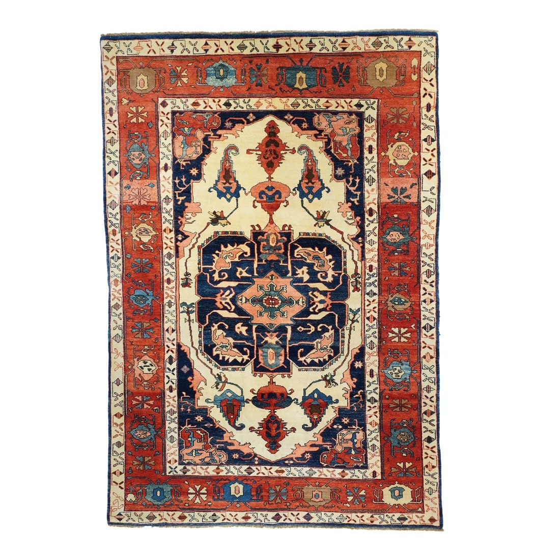 Early 21st Century Orange & Blue Serapi Rug 6'10 X 10'1": Serapi Rug 6'10 x 10'1". This Heriz/Serapi unusual-sized carpet shows a cream field centered by a beveled navy square medallion with doubled vasiform pendants. Ragged botehs grow from broken tendrils.