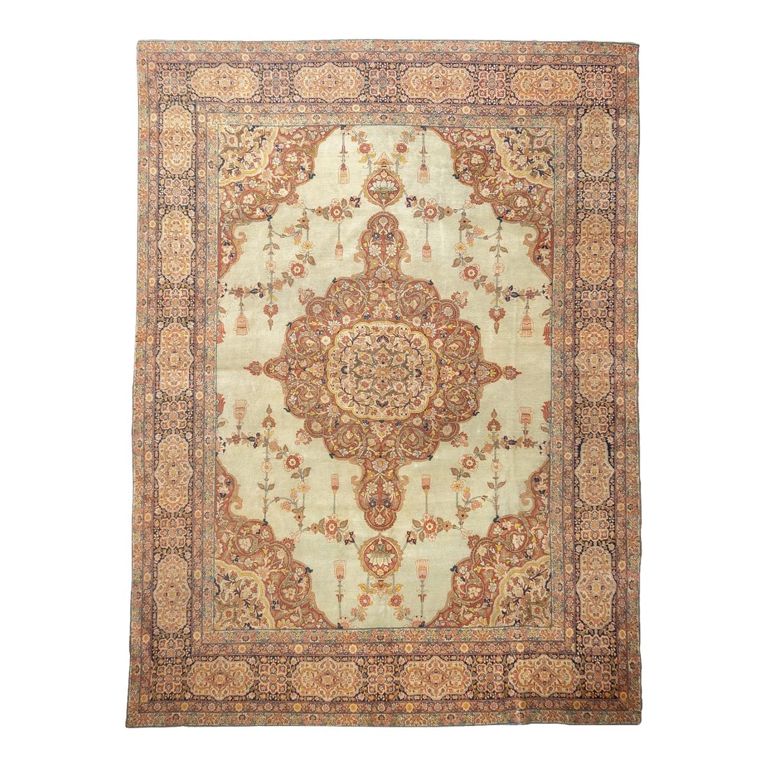 Antique Persian Haji Jalili Tabriz Rug 9'1'' X 12'9'': This "Hajji Jalili" type Tabriz carpet shows a cream field decorated with swooping racemes around a roundish lobed red medallion enclosing a goldenrod sub-medallion. The extended corners mimic the med