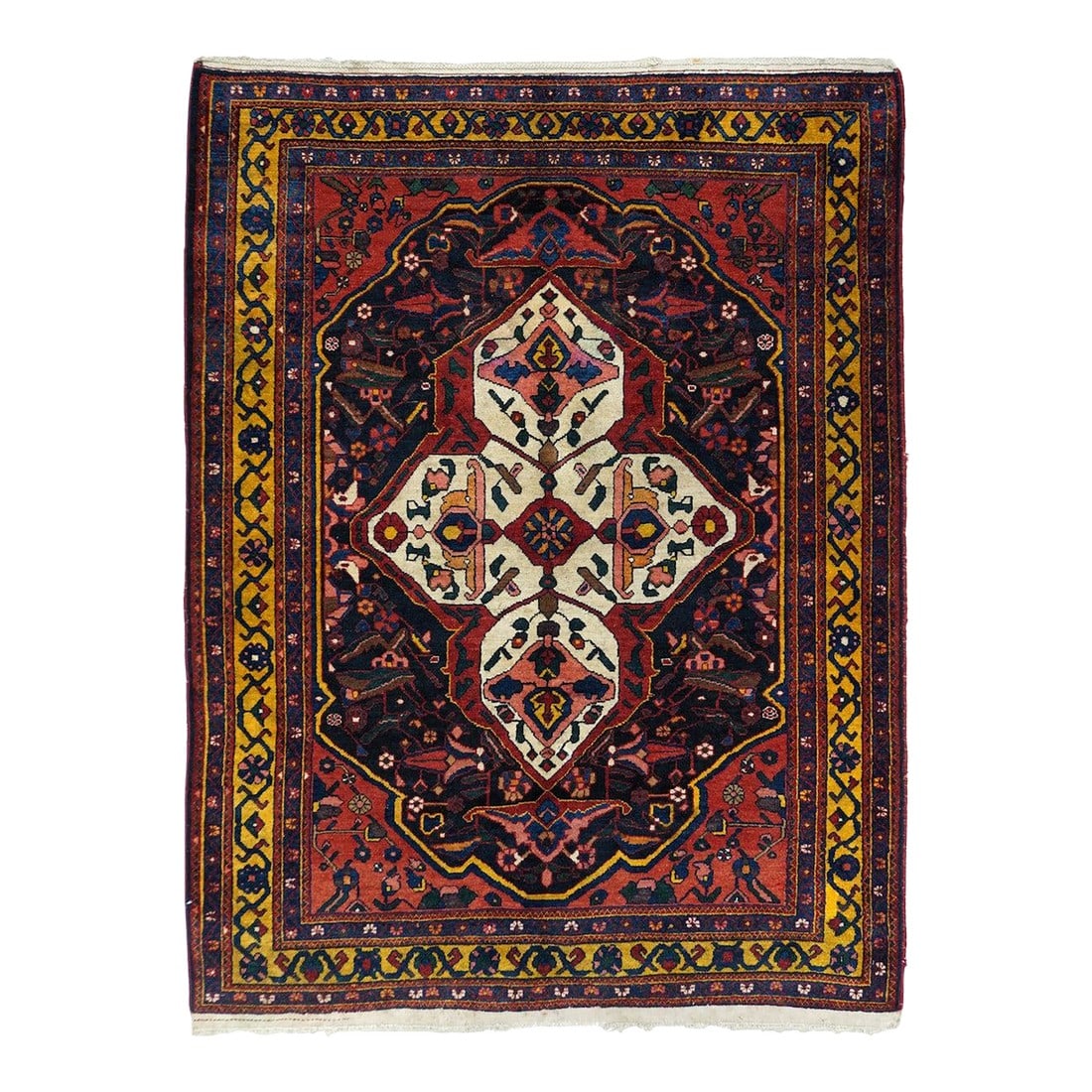 Antique Bakhtiari Rug 5'0'' X 6'4'': The particularly bold ecru medallion features four internal palmettes and four pointed finials. The red ground is centred by the notched navy sub-field. Yellow main border with rosettes, flowers and