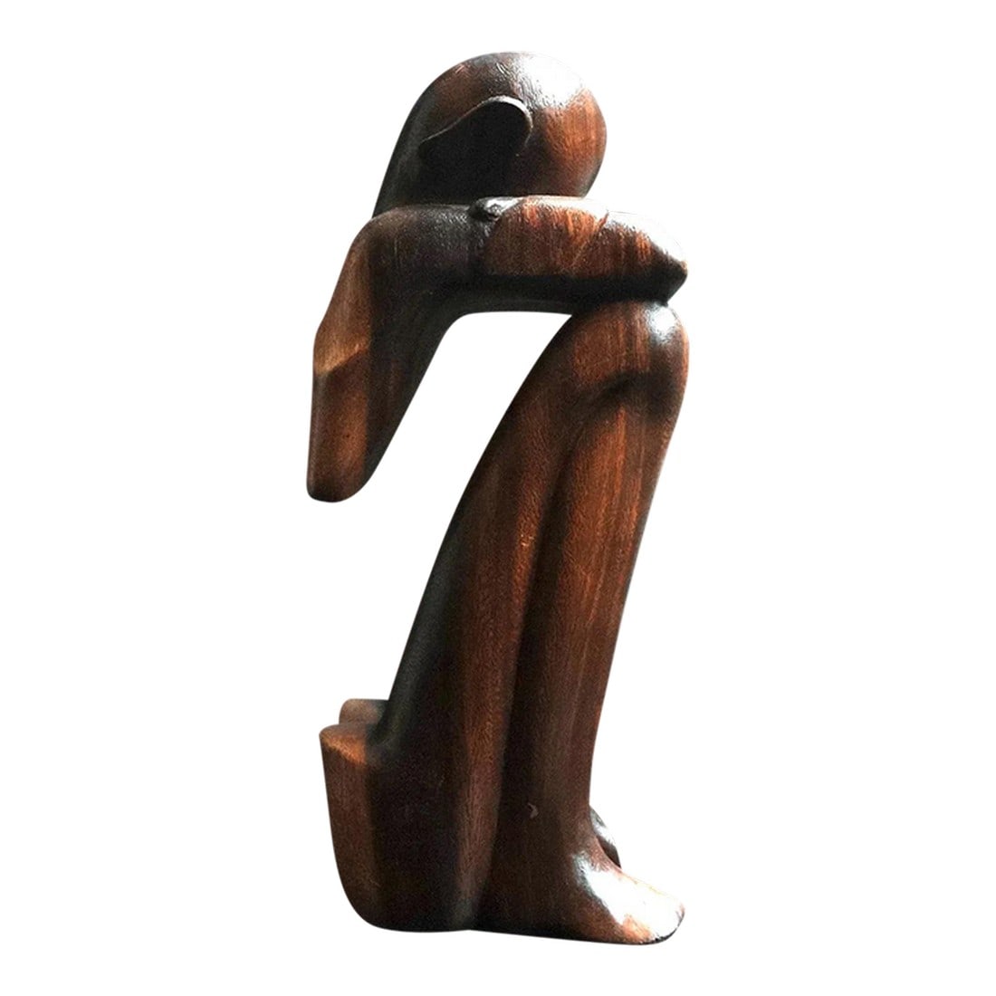 Mid 20th Century African Thinker Sculpture: Mid century This item is a hand-carved wooden statue, commonly known as a "Thinking Man" or "African Thinker" sculpture, often crafted from ebony or teak wood. Design: Features an abstract,