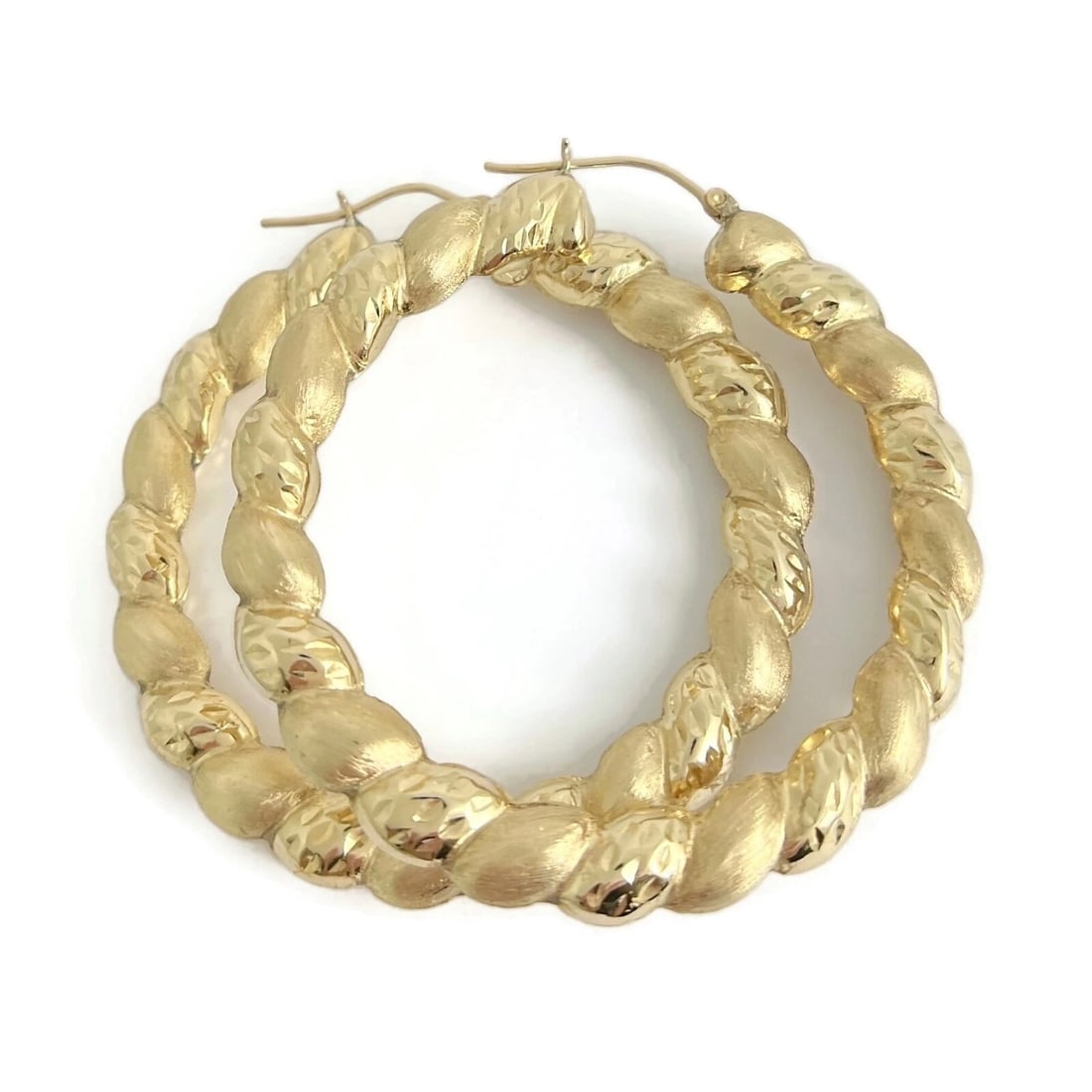 Big Satin Twisted Hoop Earrings 10K Yellow Gold, 2.5 Inches, 10.65 Grams: Big Satin Twisted Hoop Earrings 10K Yellow Gold, 2.5 Inches, 10.65 Grams These are awesome earrings! Please let us know if you have any questions. Metal: 10K yellow gold Weight: 10.65 grams Stamped: N