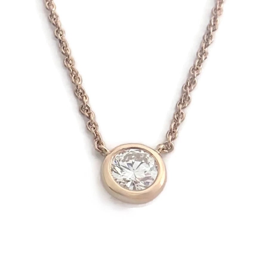 Solitaire Diamond Bezel Pendant Necklace 14K Rose Gold .56 CT, 16.75 Inches: Solitaire Diamond Bezel Pendant Necklace 14K Rose Gold .56 CT, 16.75 Inches Make a statement with this gorgeous diamond necklace. Please let us know if you have any questions. Diamond: 1 round