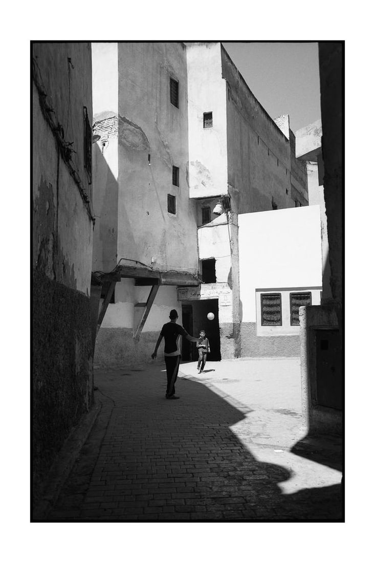 Edition 2/10 - Football, The Medina, Fes, Morocco Photograph: Title: Edition 2/10 - Football, The Medina, Fes, Morocco Photograph Description: 16 x 20 in Medium: Edition 2/10 - Football, The Medina, Fes, Morocco Photograph Paul Cooklin United Kingdom Photography