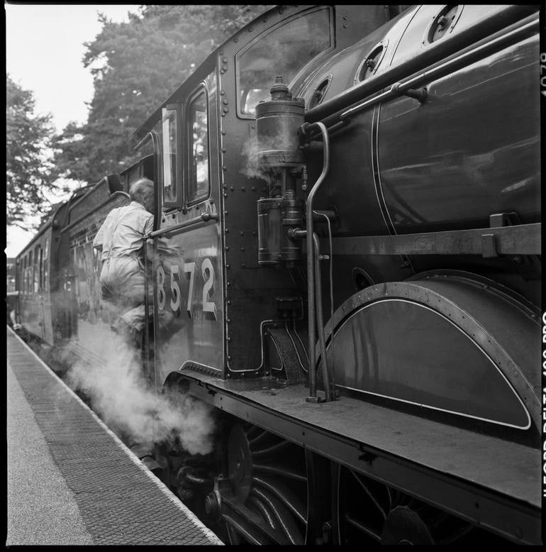 Locomotive Engineer, The Poppy Line - Silver Gelatin Photograph: Title: Locomotive Engineer, The Poppy Line - Silver Gelatin Photograph Description: 16 x 20 in Medium: Locomotive Engineer, The Poppy Line - Silver Gelatin Photograph - Limited Edition of 10 Paul