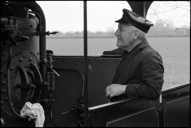 Railway Engineer, Mid-Suffolk Light Railway - Silver Gelatin Photograph: Title: Railway Engineer, Mid-Suffolk Light Railway - Silver Gelatin Photograph Description: 20 x 16 in Medium: Railway Engineer, Mid-Suffolk Light Railway - Silver Gelatin Photograph - Limited