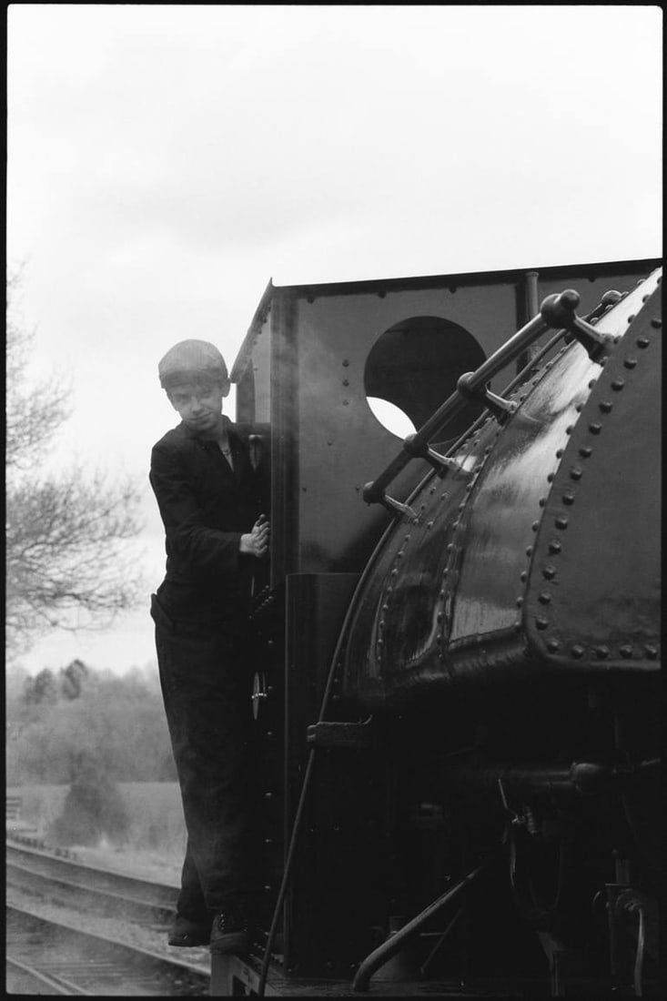 Locomotive Driver, Mid-Suffolk Light Railway - Silver Gelatin Photograph: Title: Locomotive Driver, Mid-Suffolk Light Railway - Silver Gelatin Photograph Description: 16 x 20 in Medium: Locomotive Driver, Mid-Suffolk Light Railway - Silver Gelatin Photograph - Limited