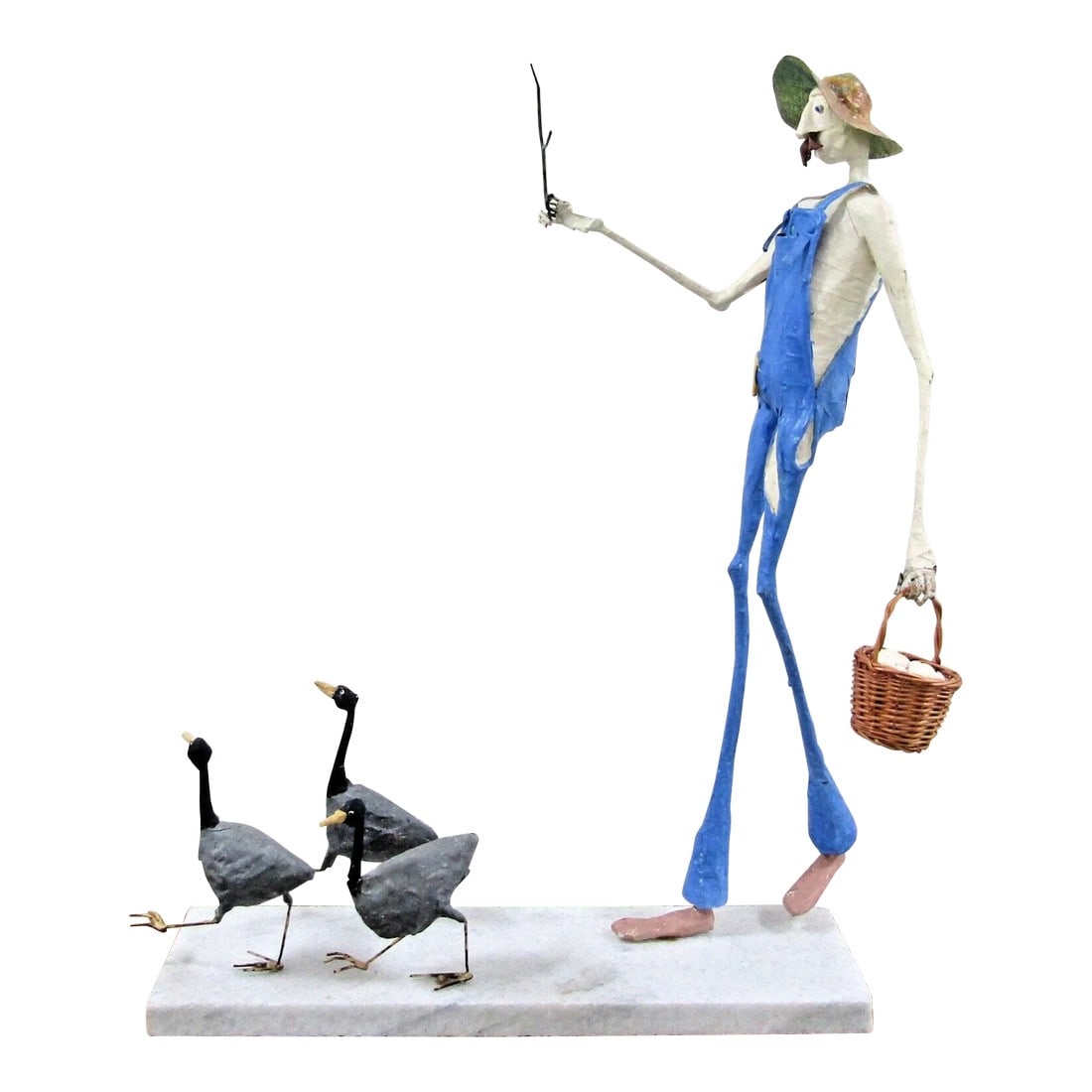 Paper Mache Sculpture of Elongated Farmer and Geese Attributed to Paul Duval: Large Paper Mache Sculpture on White Marble Base of Elongated Farmer Carrying Eggs in a Basket Chasing after Geese attributed to Paul Duval Hand formed from paper mache and aluminum. An engaging sculp
