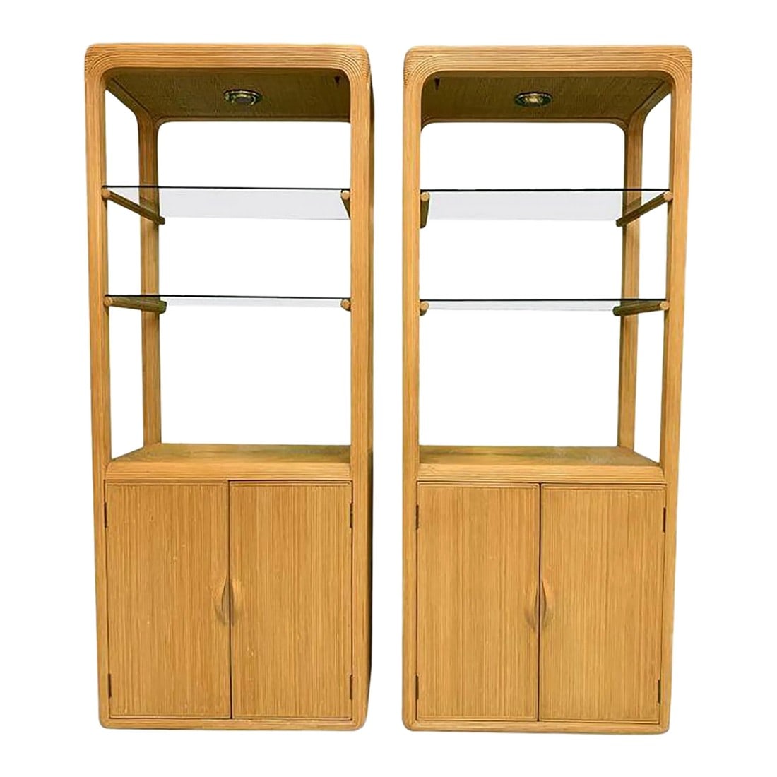1970s Matched Pair of Pencil Reed Etageres in the Style of Gabriella Crespi: Matched Pair of Pencil Reed Etageres in the Style of Gabriella Crespi This pair of matching wall units each has two glass shelves and two lower doors opening to a fixed shelf. Each cabinet has a reces