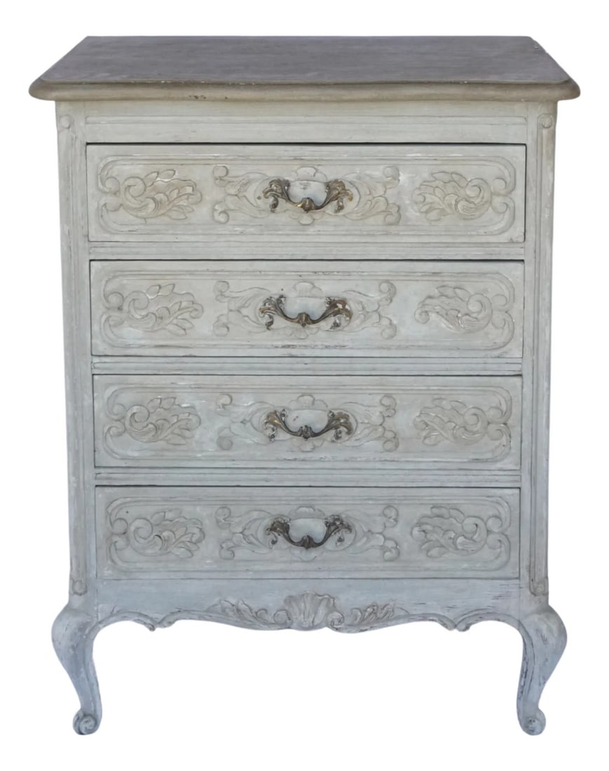Petite French Painted Commode – Hand-Carved Details & Old World Finish: This petite French commode is full of charm, featuring hand-carved scrollwork on all four drawer fronts and classic escargot feet below. Its softly scalloped apron echoes the delicate carvings, while 