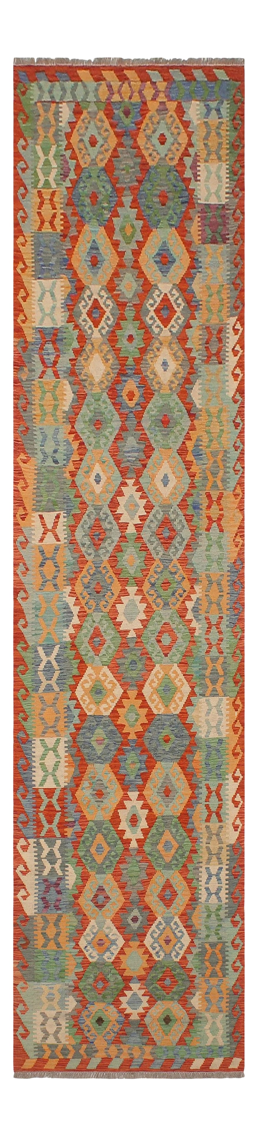 Navajo Style Kilim Rust Blue Hand Woven Rug - 2'10" X 12'6": Add a touch of elegance to your home with this casual chic hand woven Tribal Kilim wool rug. Constructed on a loom by Nomad Turkman people with hand spun wool and 100% Natural Vegetable dyes these