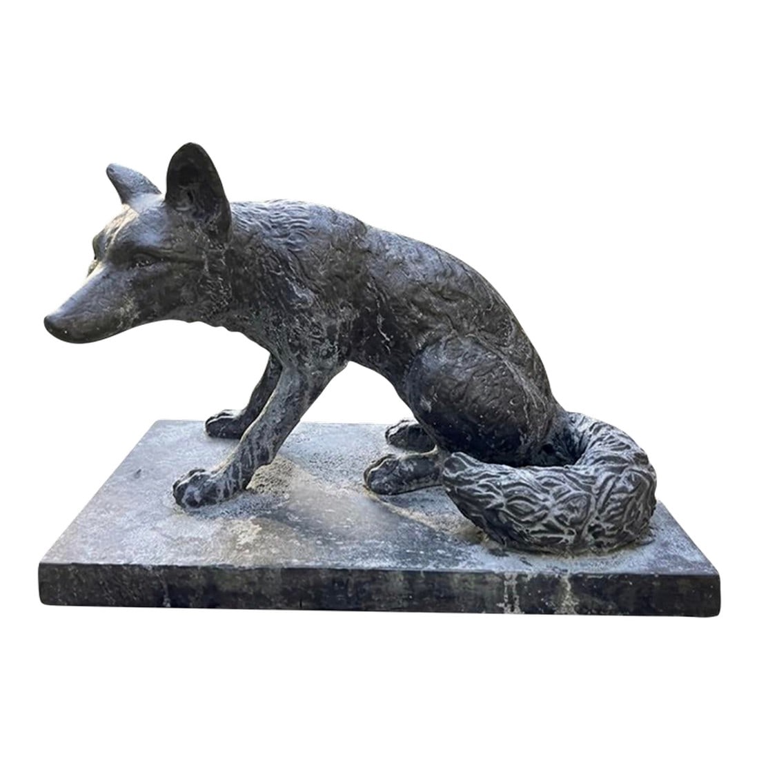 Vintage Cast Iron Sitting Fox Garden Statue: An impressive vintage cast iron fox statue.Meticulously crafted from solid cast iron, this piece features a heavy, substantial presence and a beautifully weathered, dark patina. The fox is depicted
