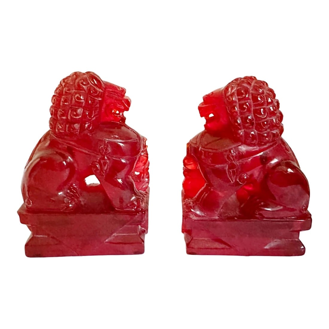 Pair of Vintage Chinese Cherry Amber Foo Dogs Temple Fu Lions Figurines: Pair of Vintage Chinese Cherry Amber Foo Dogs Temple Fu Lions Figurines This is a set of two antique Chinese carved cherry amber resin figurines or bookends. They are called Foo Dogs or Temple Fu Lion