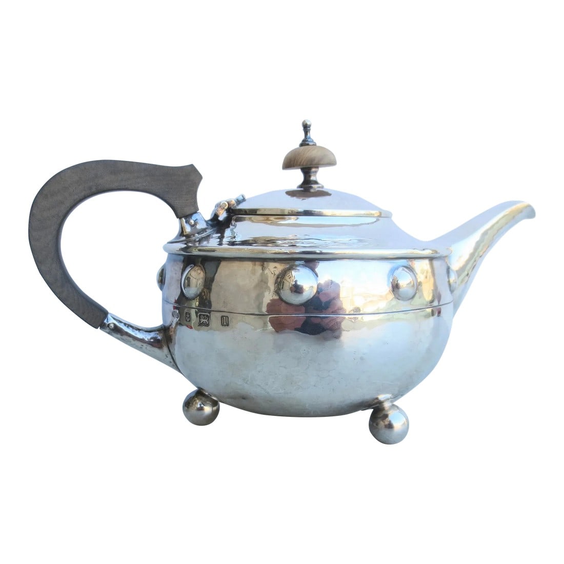 Antique Arts and Crafts Sterling Silver Tea Pot Circa 1910: Sterling Silver Arts and Crafts teapot by English Maker A.E Jones. Made circa 1910 in Birmingham, England. Beautifully proportioned with a hammered surface, a pattern of stud bosses, and ball feet. Th