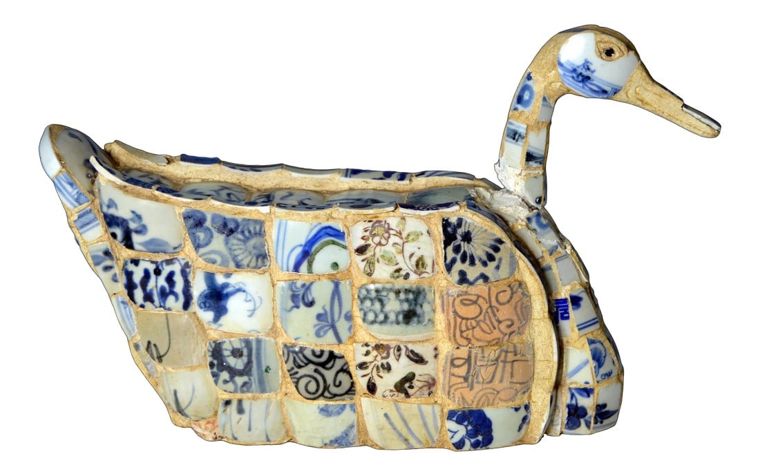 Vintage Chinese Faience Duck Sculpture with Blue Oriental Accents: A Chinese faience duck sculpture with blue oriental accents. Faience is tin-glazed pottery on a delicate pale buff earthenware body, a Chinese technique the Dutch copied in 17th century as part of