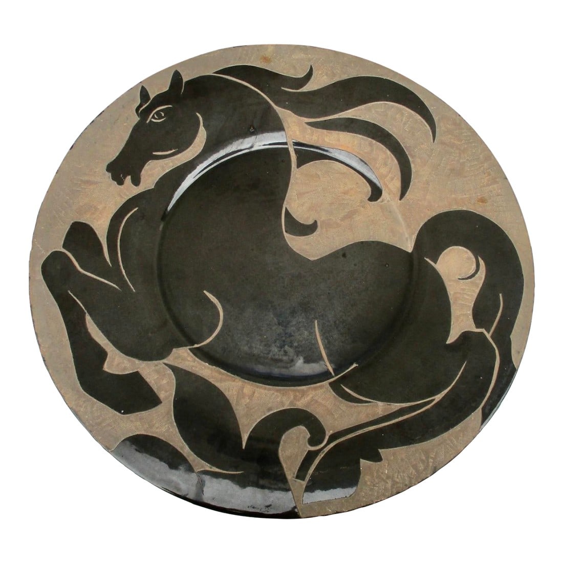 Art Brut Stoneware Horse Charger Circa 70s: Stoneware charger from Biot, France, vintage 70s. Glazed in glossy black over the whole, the horse image is drawn on the glaze and then hand-carved and drilled into the clay surface. Art Brut design w