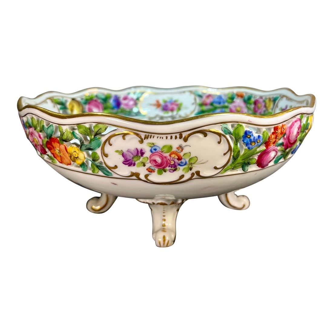 Antique Dresden Footed Reticulated Porcelain Bowl: Features hand painted floral designs in red, pink, and purple and a reticulated pierced lattice border with gilt highlights. Condition: Alterations: Original Condition Unaltered Imperfections: Some Im