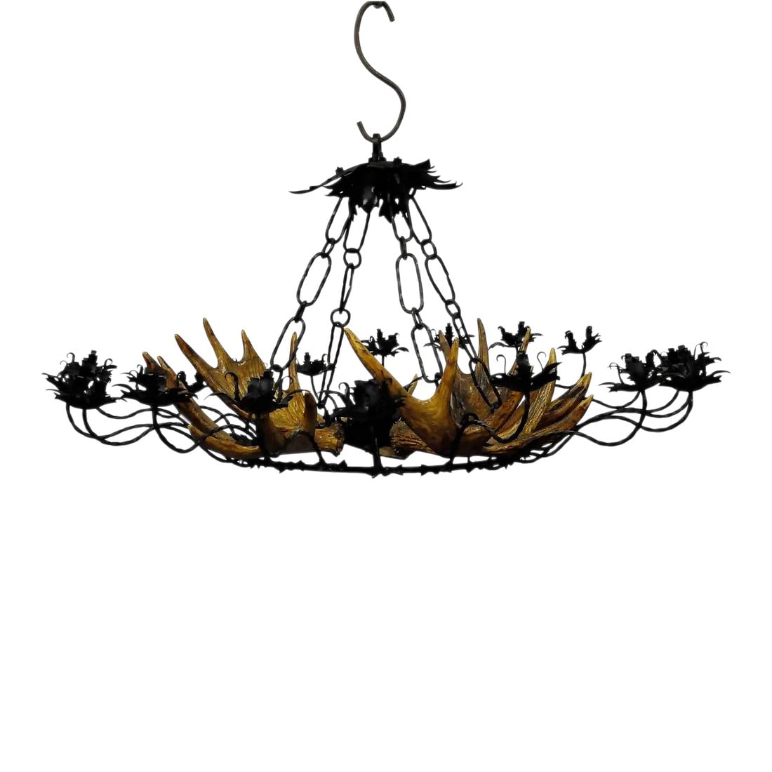 Vintage Antler Chandelier With Forged Iron Suspension: Vintage Antler Chandelier with Forged Iron Suspension A beautiful filigree worked forged iron chandelier with 4 large elk antlers. Excecuted ca. 1950. The chandelier has 20 spouts for candles and is