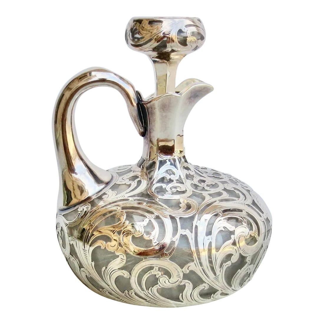 Antique Alvin Silver Overlay Decanter Circa 1890: Antique Alvin Silver overlay decanter with stopper. Circa 1880s-90s. cut crystal bottle with star-cut bottom fitted original stopper, and great weight. Brandy or aperitif ready. The surface is a