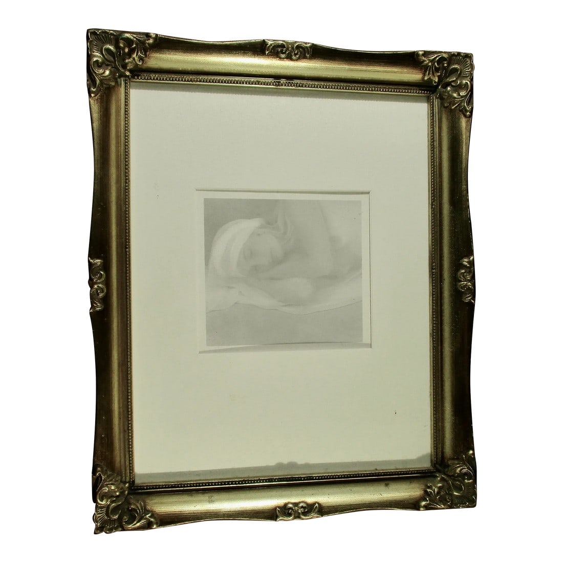 Black and White Studio Photo of Nude by E Simson Circa 70s: Black and white studio nude photo of a reclining female. Composed of a very muted palette of bright white to subtle grey tones. The image lies in a sleeping posture, the white gauzy focus blends all