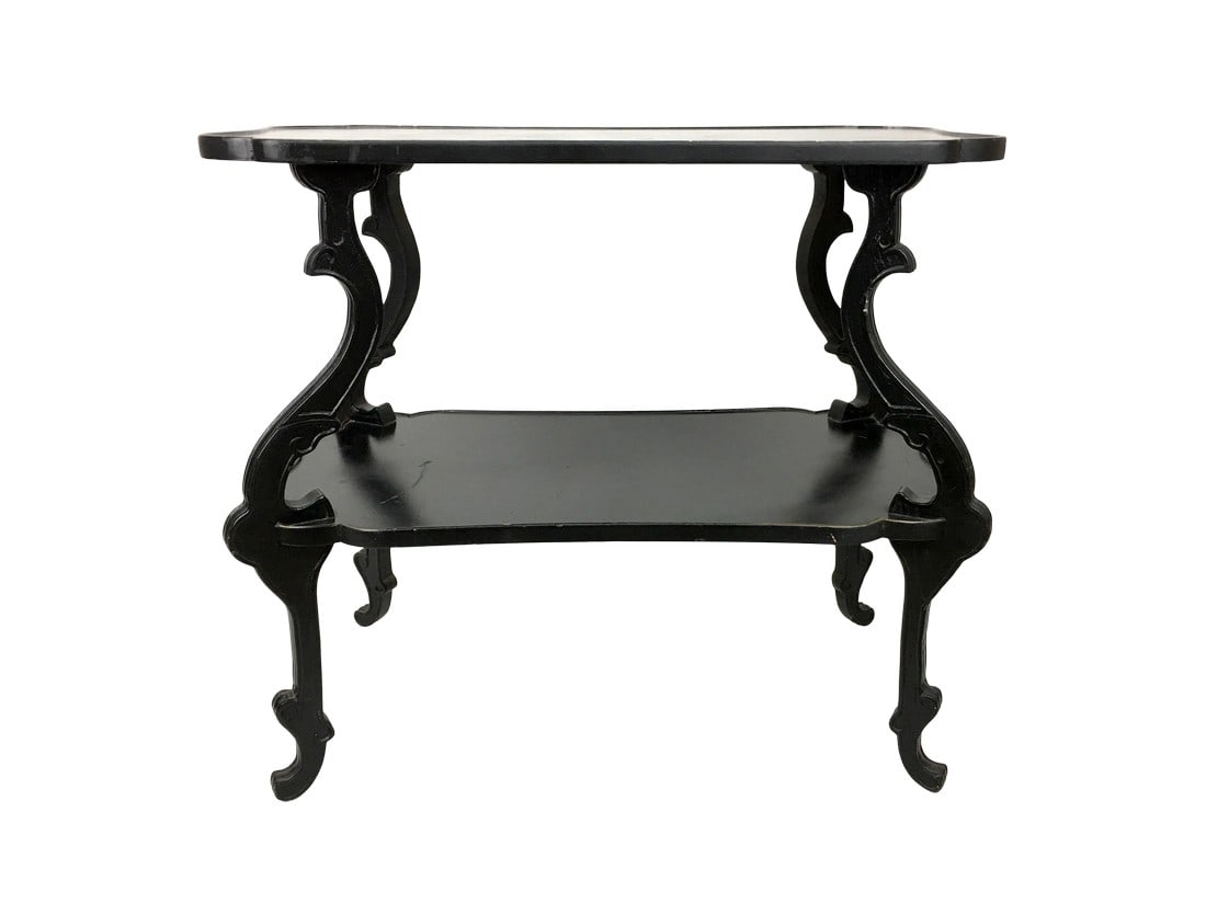 20th Century English Style Wooden Side Table: Vintage English style wooden side table with carved cabriole legs and shelf, scalloped top design in black ebony. Made in the early 20th century. Condition: Alterations: Original Condition Unaltered