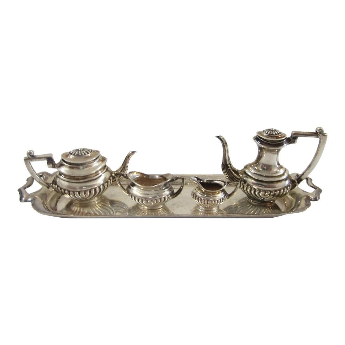 1930s English Art Deco Sterling Silver Miniature Coffee Tea Service- 5 Pieces: English Art Deco Sterling Silver Miniature Coffee Tea Service Marked Base W A H Overall measures 5 3/4" long and 1 3/4" wide. Total weight 65.5 grams. Condition: Alterations: Original Condition