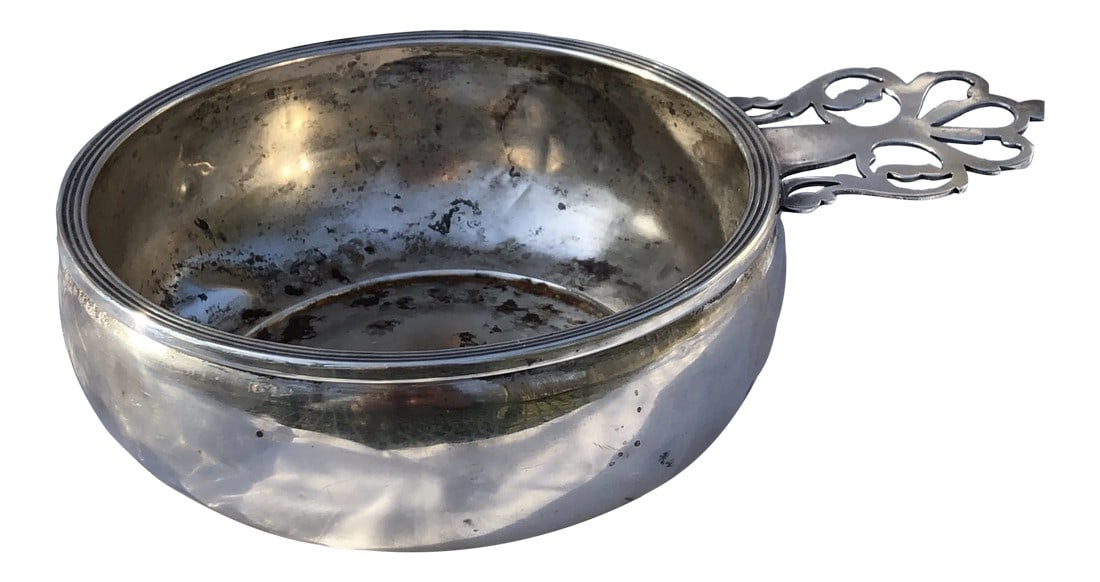 1950s Sterling Silver Porriger With Pierced Handle: Sterling silver porriger with pierced handle, circa 1950. Ellmore Silver Company. This was used as an ashtray, so there are cigarette burn marks on the interior of the bowl. Basically a round baby's