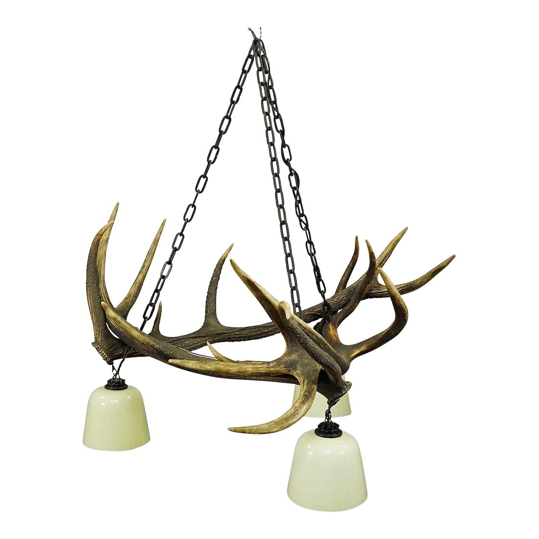 Rustic Antler Lamp With Deer Antlers: Rustic Antler Lamp with Deer Antlers A large antler chandelier made of three joined deer antlers. The lamp comes with 3 spouts, vintage glass shades and a handforged iron chain suspension.