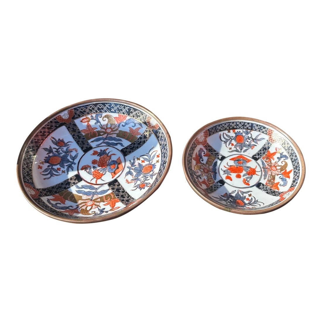 Pair of 1970s Asian Ceramic Plates With Brass Lining: Up for consideration is a beautiful pair of Asian ceramic plates with a brass lining on the outside. These would look lovely in your home and they are a great find for the interior design enthusiast.