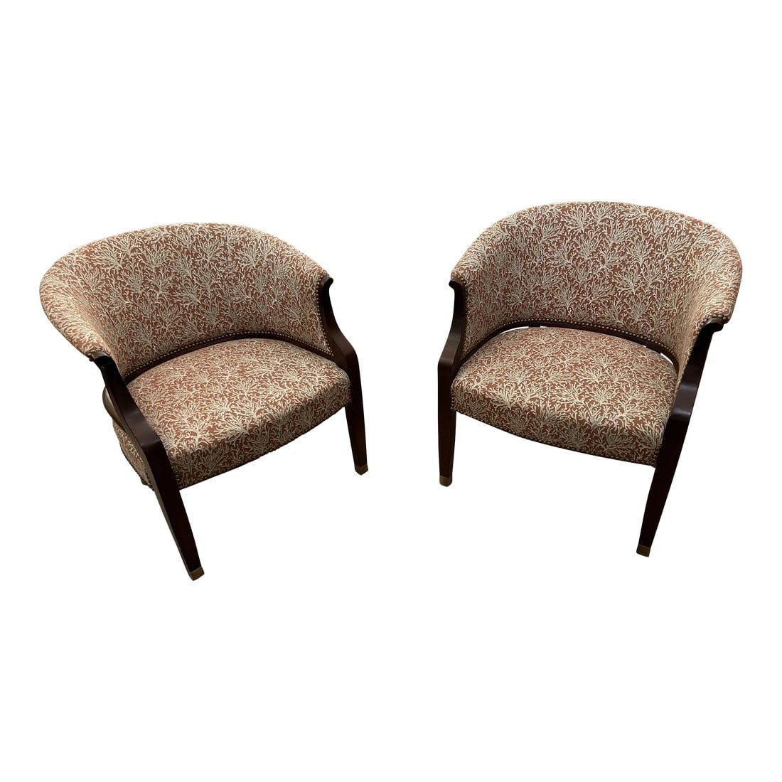 Upholstered & Mahogany Club Chairs- a Pair: Stunning pair of curved upholstered club chairs having warm burnt orange and cream fabric with a twig pattern and warm mahogany frames. Details such as brass nailheads and capped feet make these a win
