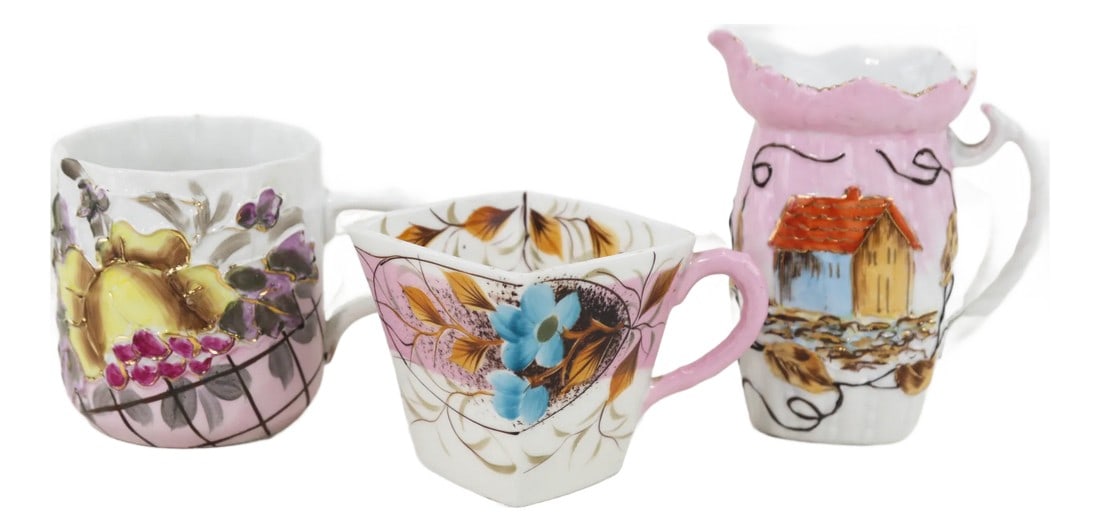 Vintage Victorian Hand-Painted Porcelain Mugs & Pitcher Set – Unique Floral & Landscape: This charming set includes two intricately decorated Victorian-era porcelain mugs and a matching small pitcher, each featuring unique hand-painted designs. The hexagonal teacup is adorned with blue