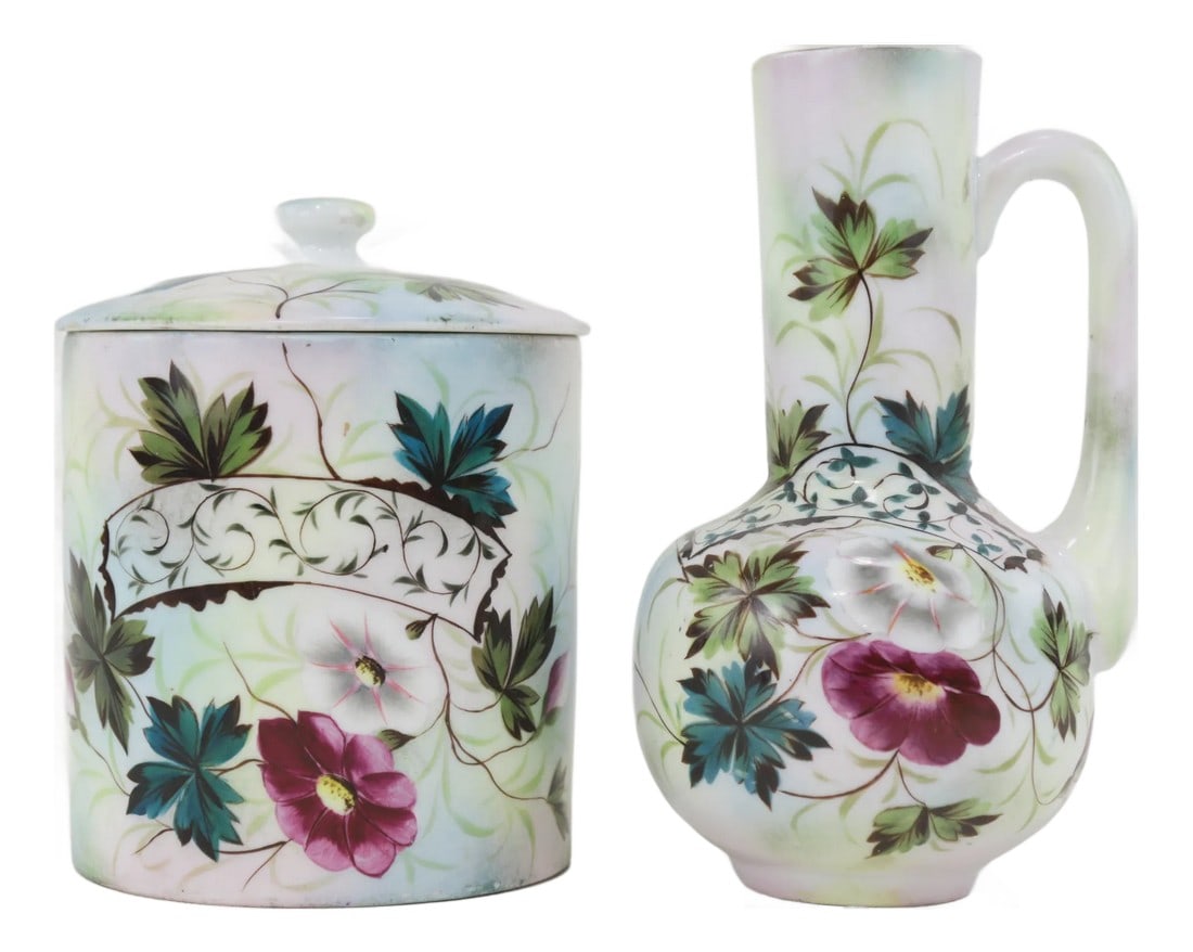 Vintage Victorian Hand-Painted Floral Canister & Pitcher Set: A beautifully preserved Victorian-era canister and pitcher set, hand-painted with delicate floral motifs in soft pastel hues. The intricate scrolling details and vibrant flowers add an elegant touch,