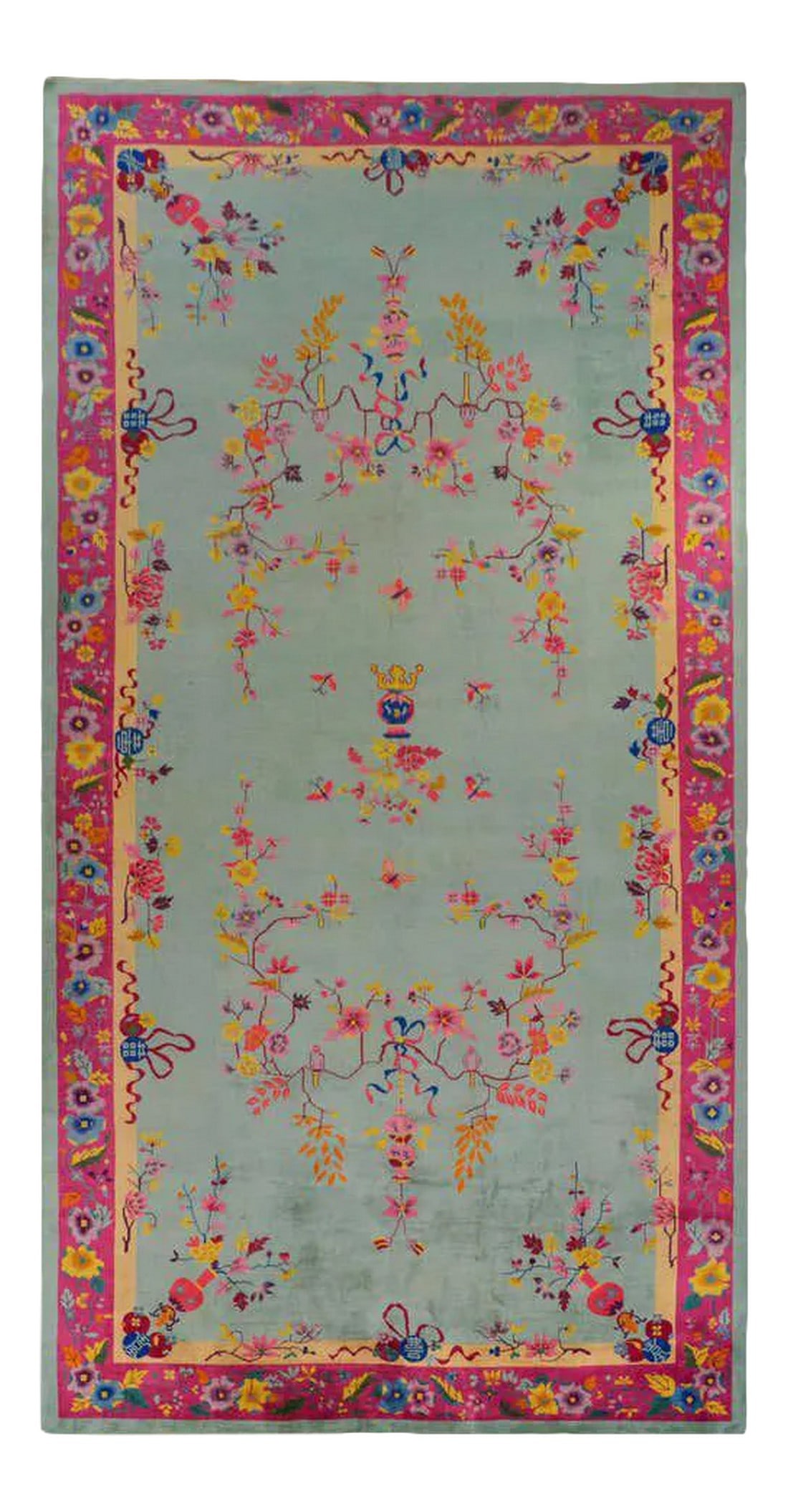 Chinese Art Deco Rug: A brilliant Chinese Art Deco rug with an unusual color palette of pinks, fuchsia, gold, orange, and lavender on a pale indigo background surrounded by a border of myriad flowers and leaves woven in br