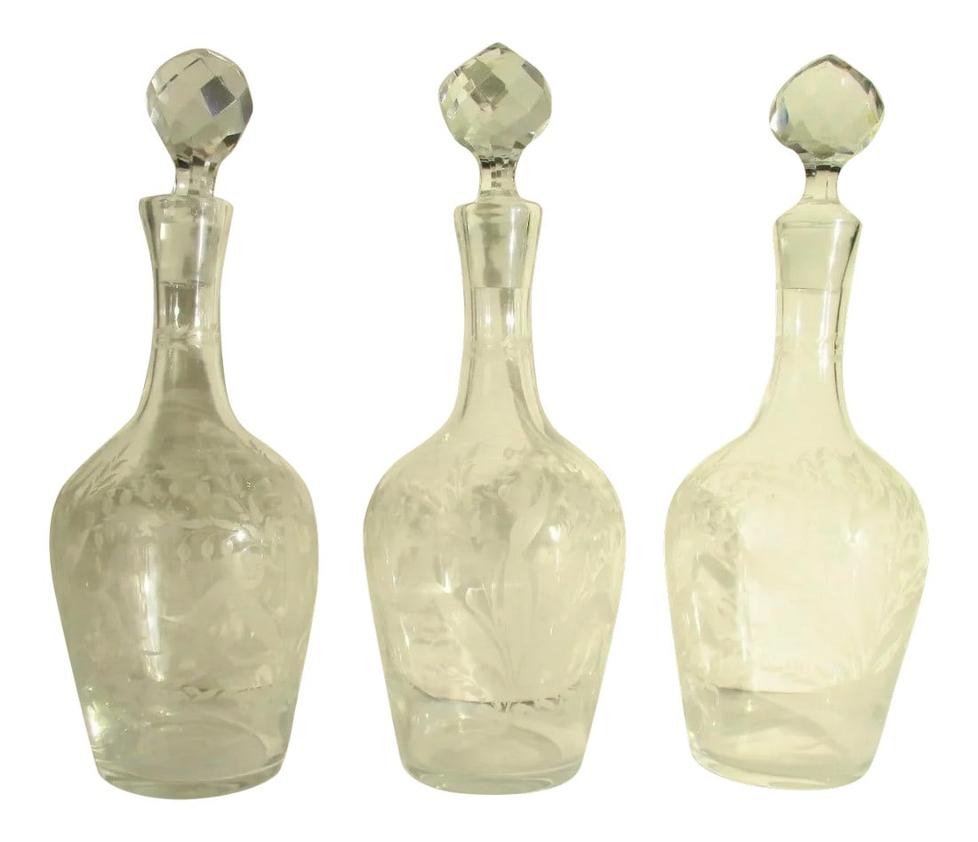 Antique Cut Glass Liqueur Decanters - Set of 3: Antique set of 3 liqueur decanters from Czechoslovakia. Lily of the Valley pattern hand-cut into each decanteur and each with a crystal stopper. Turn of the century design of lily of the valley patter