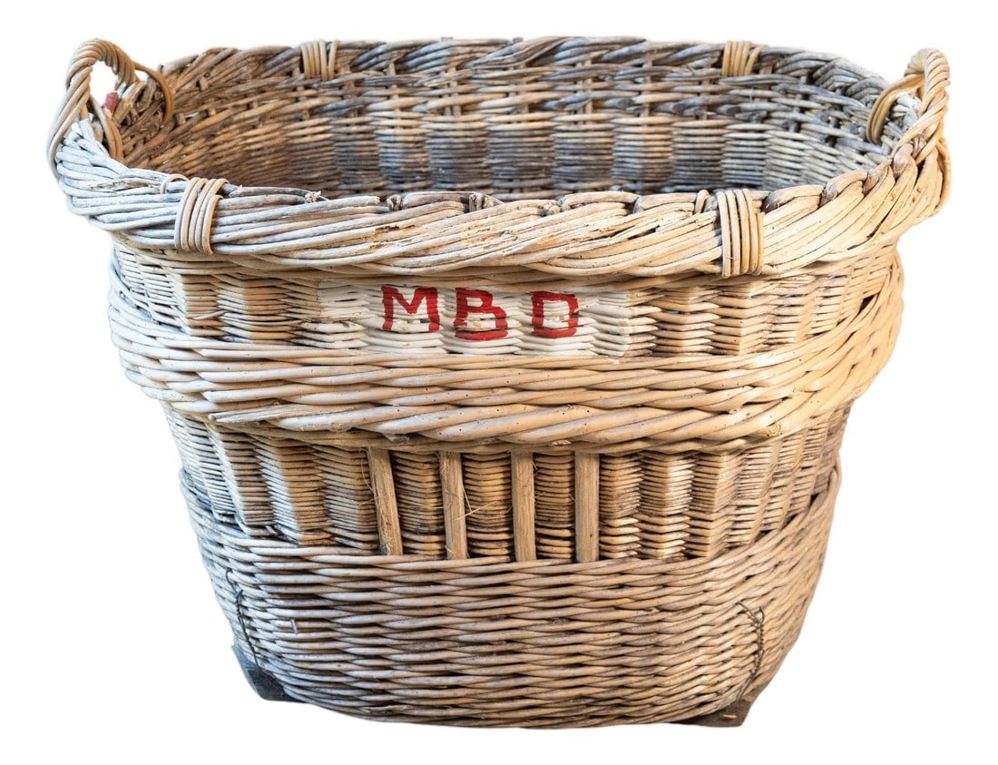 French Champagne Harvesting Basket: A handsome mid-20th-century French Champagne harvesting basket, handwoven from willow and steeped in the rustic traditions of the French wine country. Originating from the Champagne region in the