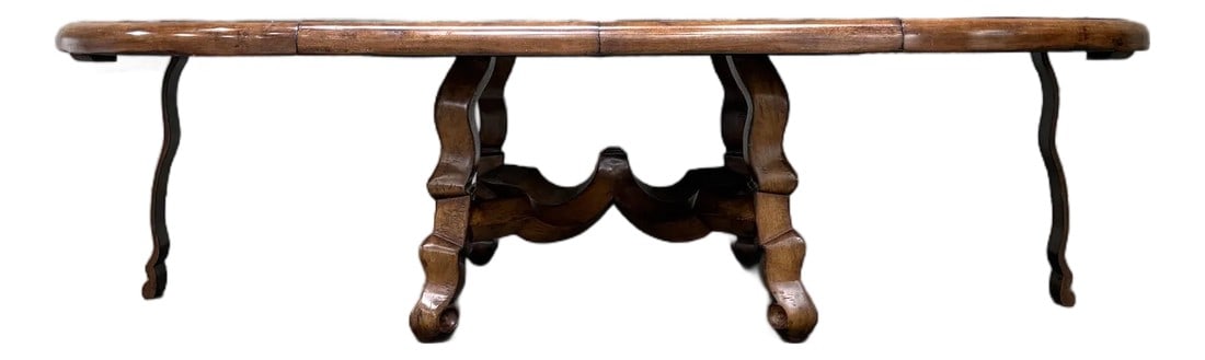 Custom Early Spanish Style Walnut Dining Table – Round to Oval With Leaves, Carved Stretcher: An impressive custom early Spanish style walnut dining table, commissioned through Tucker & Marks Interior Design, San Francisco. The table features a round top that extends to an oval with one or