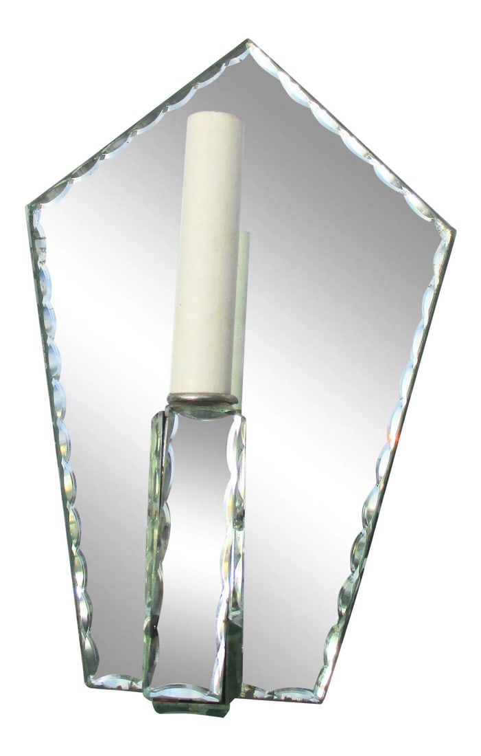 Hollywood Regency Mirrored Single Light Sconce: Mirror backed wall sconce with single-armed candelabra socket electrical. Faceted beveled panels with crystal attachment beads. L-shaped arm extends out with a measurement of 5" out and 8" tall. The