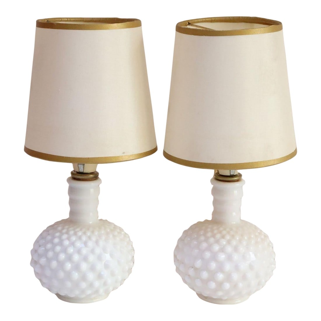 Pair of Petite Mid-Century Modern Hobnail Milk Glass Boudoir Bedside Table Lamps: Pair of petite vintage hobnail-form milk glass table lamps (ca. 1950, USA). Charming, elegant pieces to enhance a boudoir or bedside table emitting an attractive, soft light. Shades are for