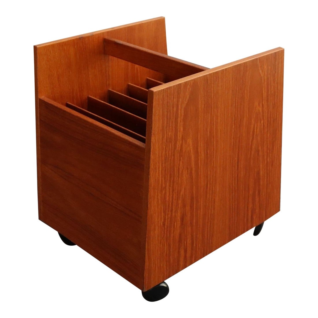 Norwegian Modern Magazine Rack on Casters by Rolf Hesland for Bruksbo in Teak: Mid-Century Norwegian Modern teak magazine rack designed in the 1960s by Rolf Hesland for Bruksbo. Features six slots for books/magazines with a sculptural handle, all supported by four caster wheels