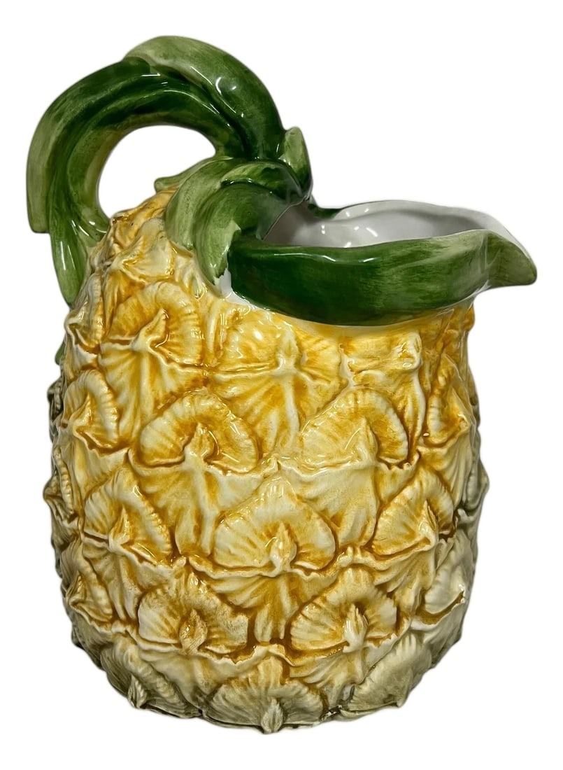 Vintage Majolica Hand Painted Italian Pineapple Pitcher: Vintage majolica hand painted pineapple pitcher with green stem handle. . Made in Italy Measures 8"w x 6" d x 9" h. Condition: Alterations: Original Condition Unaltered Imperfections: Some