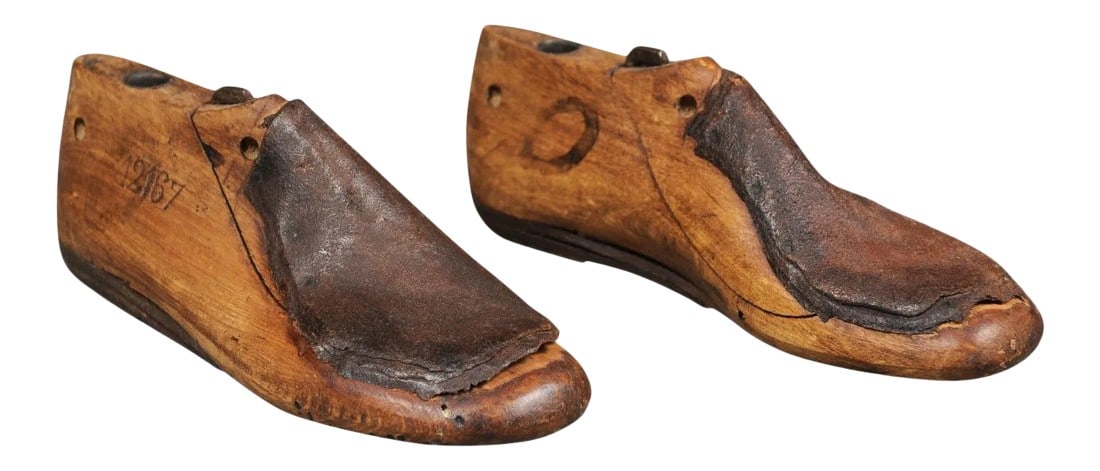 English Vintage Wood and Leather Handmade Cobbler's Shoe Lasts - A Pair: A vintage pair of English wood and leather cobbler's shoe lasts from the 20th century, numbered on the side. Handmade out of wood and used to create shoes for certain clients, this pair of shoe lasts