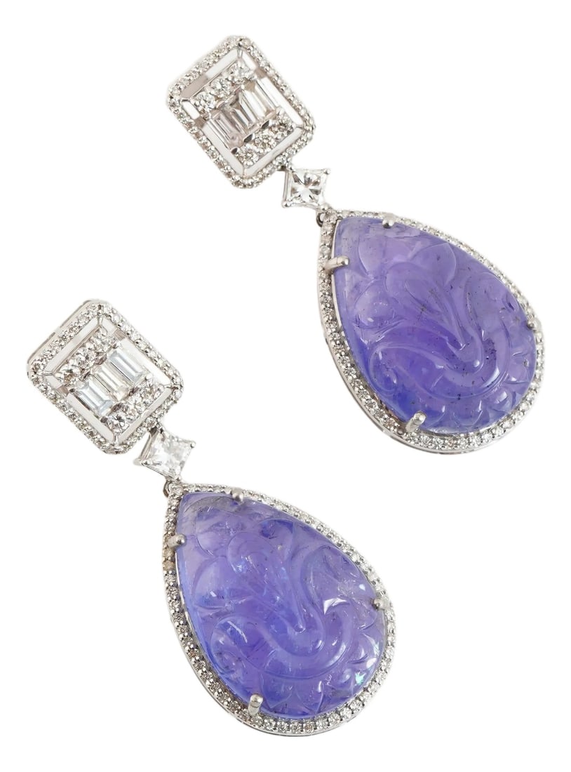 Natural tanzanite diamond earring in 18k gold: GW=15.060gm NW=7.0608gm diamond round=0.52cts diamond sq=0.42cts diamond baguette=0.52cts tanzanite=35.40cts These all are brand new pieces . Condition: Imperfections: No Imperfections Condition