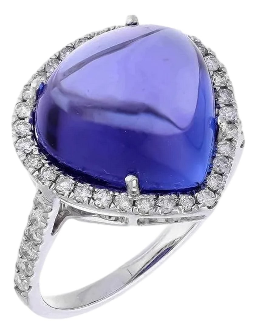10.10 Ct Natural Tanzanite Cabochon & 0.40 Ct Natural Diamond Ring in 18KW Gold: This extraordinary large Cabochon of 10.10 carat tanzanite is a true gemstone that is highly treasured. It is surrounded by a total of 0.40 carats of shimmering white diamonds, which adds to the overa