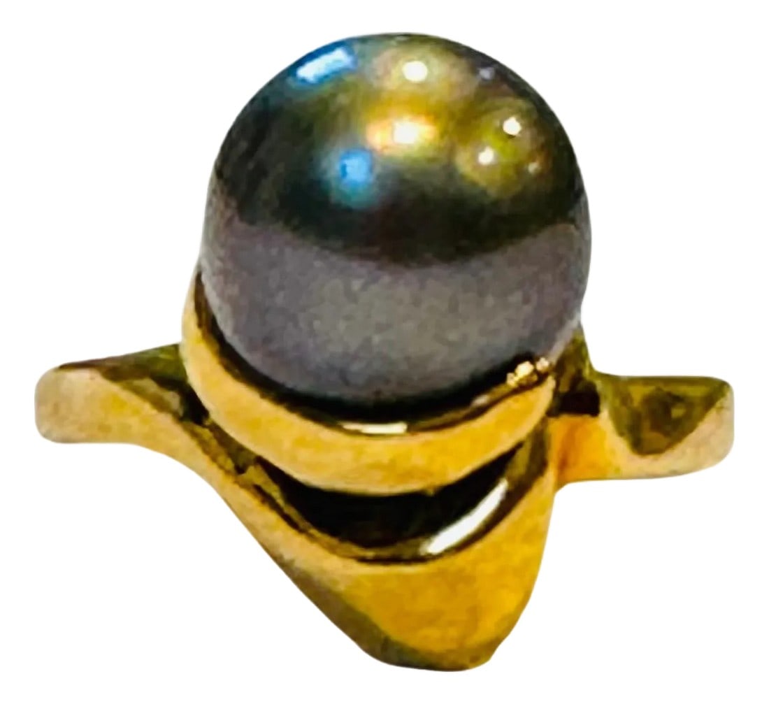 Black Tahitian Pearl 9.3 MM Cocktail Ring 18 Karat Yellow Gold: Black Tahitian Pearl 9.3 MM Cocktail Ring 18 Karat Yellow Gold Size 6 A classic, Cocktail ring 9.3 mm Pearl very clean , in round shape , full of luster and shine . 18 Karat Yellow gold Weight: 7