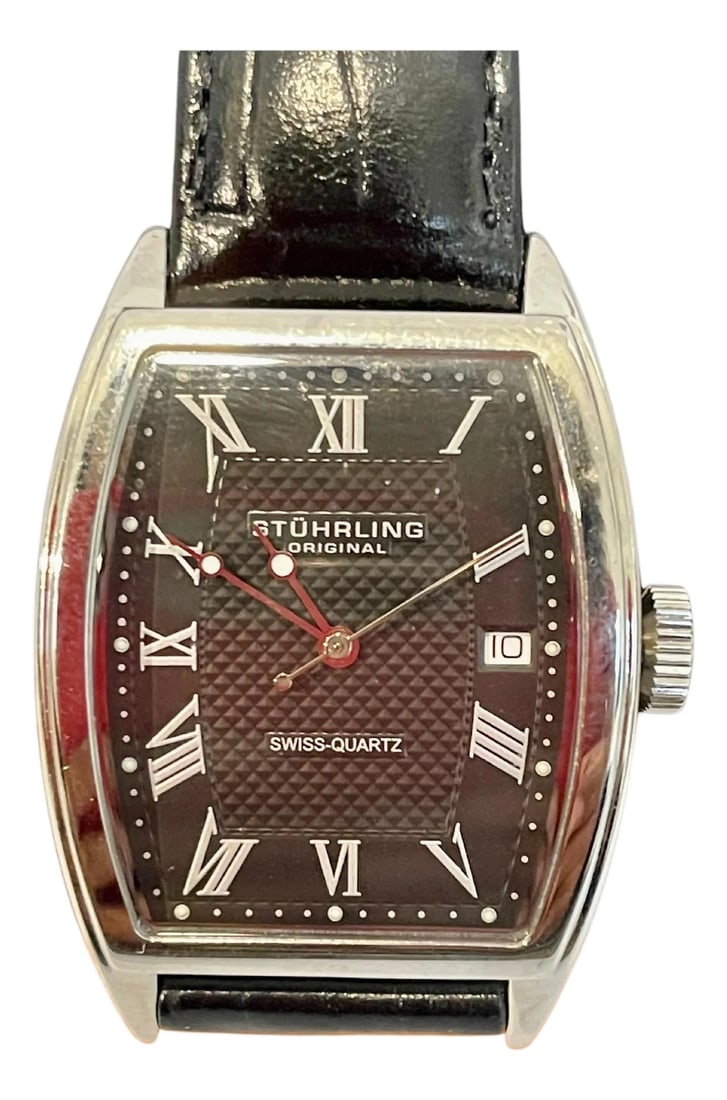 Stuhrling Brand New Watch with Box Paper and Leather Belt: Watch is Brand New in a box Total length of the watch with leather belt is 9 inch Department: Men Case Color: Silver Brand: Stuhrling Case Material: Stainless Steel Case Size: 32mm Movement: Swiss