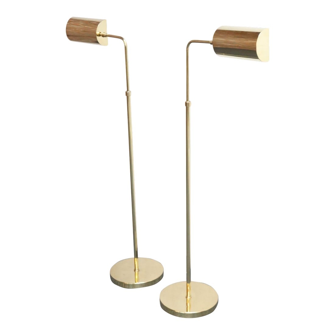Pair of Vintage Fully Adjustable Floor Lamps by Chapman in Polished Brass: Pair of modernist polished brass floor lamps by Chapman (ca. 1970s, USA). Versatile in style and application featuring classic half-round pharmacy shades, which swivel and articulate, mounted to