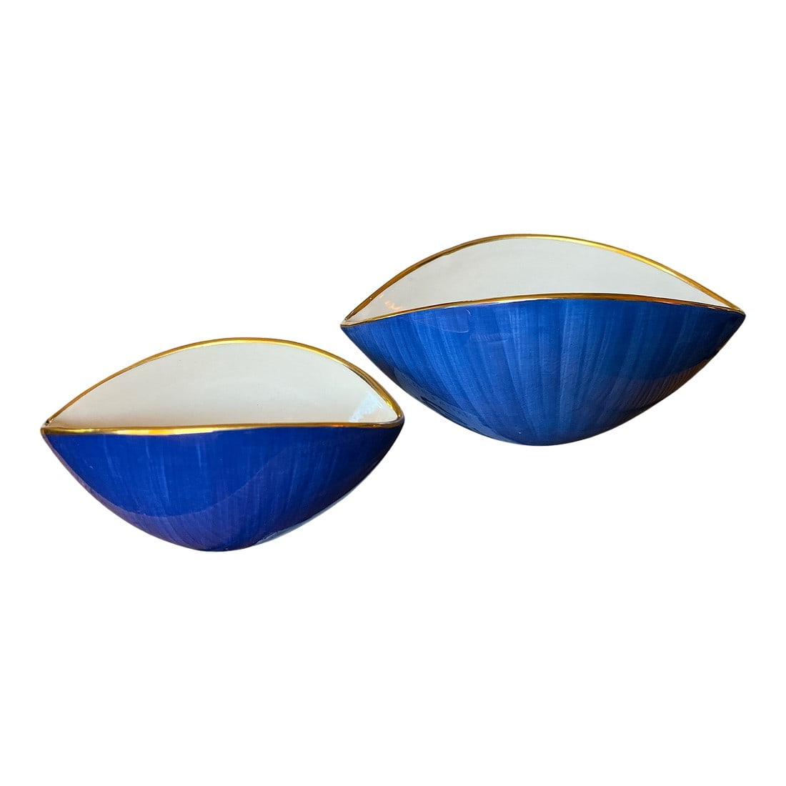 Pair of Hand-Painted L'Objet "Circe" Bowls | Blue, White & Gold | Portugal, 2005: A striking pair of hand-painted porcelain bowls from L'Objet's iconic Circe collection, dated 2005 and crafted in Portugal. These sculptural bowls feature an elegant asymmetric oval form with a rich