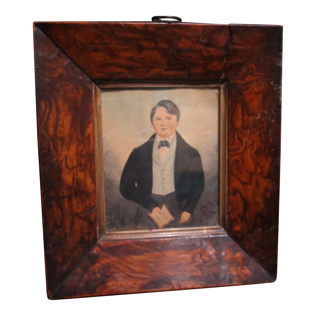 19th Century Portrait of a Young Man Watercolor: Classic portrait of a fine young man from the 19th century. Portly and well-dressed, holding a small book, likely a bible copy. Formal dress with a black collar and waistcoat. Well drawn in a folk